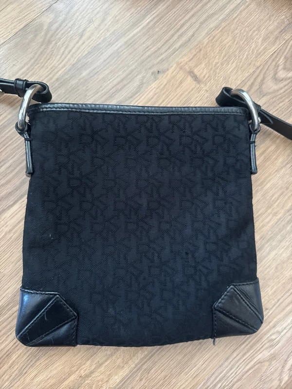 DKNY DKNY leather and canvas monogram cross body bag. Zipped and has zip pocket great condition