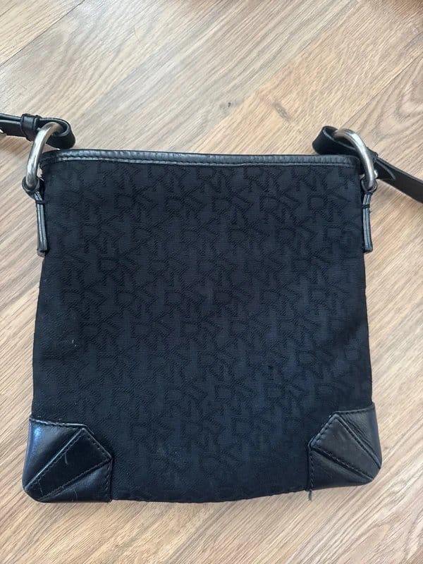 DKNY DKNY leather and canvas monogram cross body bag. Zipped and has zip pocket great condition - 1