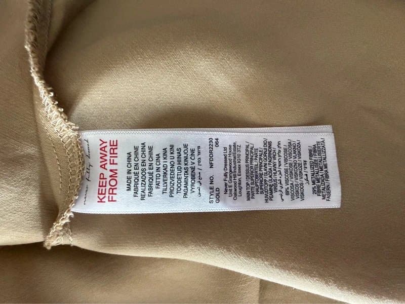 Never Fully Dressed Stunning gold cocktail dress with sequin detail to the top