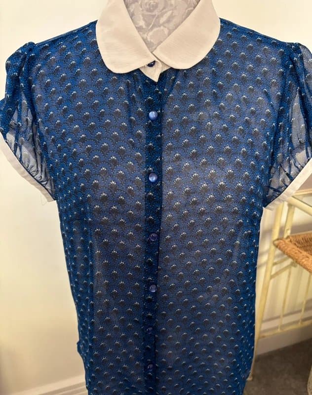 New Look Women’s chiffon blouse with white collar and white edging around the sleeves.