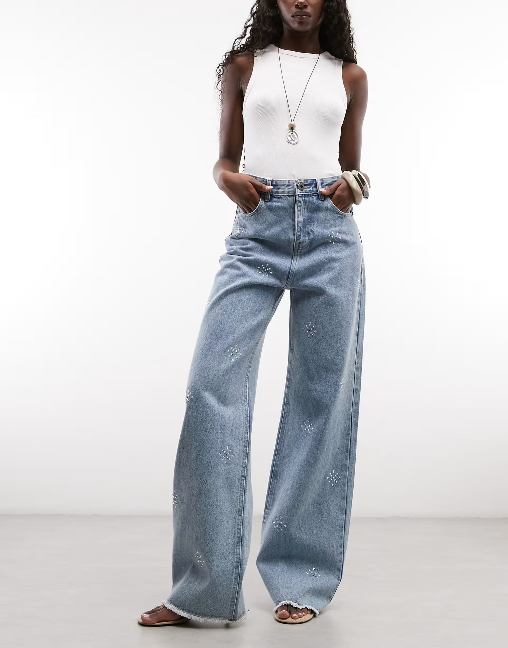 ASOS Courtside baggy wide leg embellished jeans with raw hem in light wash blue
