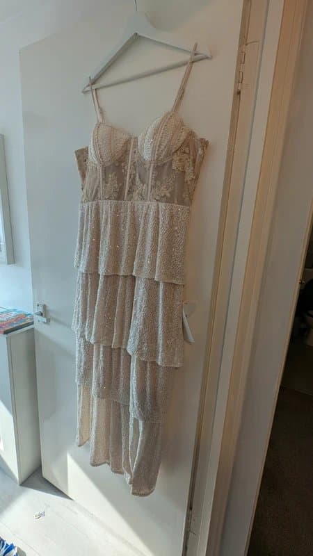 Never Fully Dressed Cream corset dress with tiered sequin bottom.
