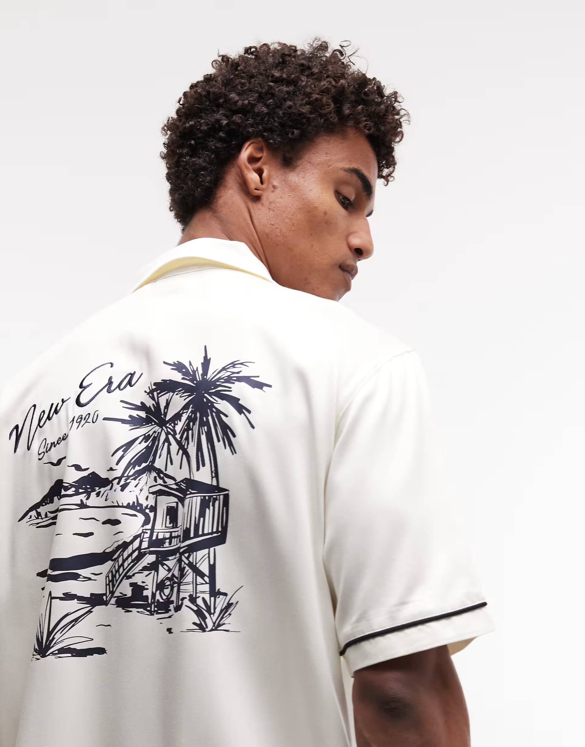 ASOS New Era graphic logo short sleeve revere shirt in off white