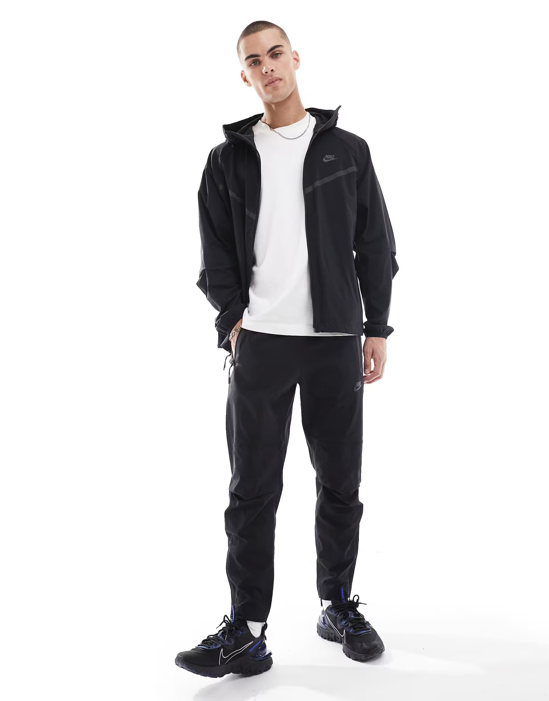 ASOS Nike Tech Woven open hem trousers in black