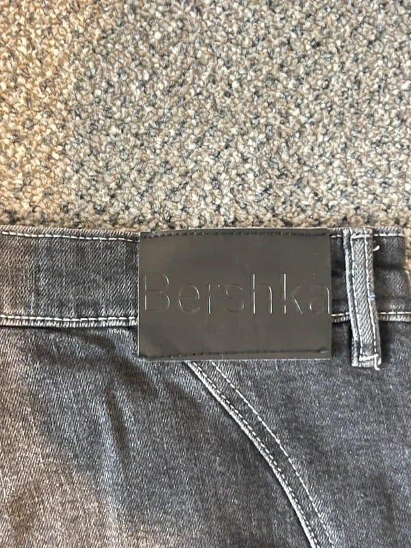 Bershka Patchwork Flare Jeans in Black and Grey Denim