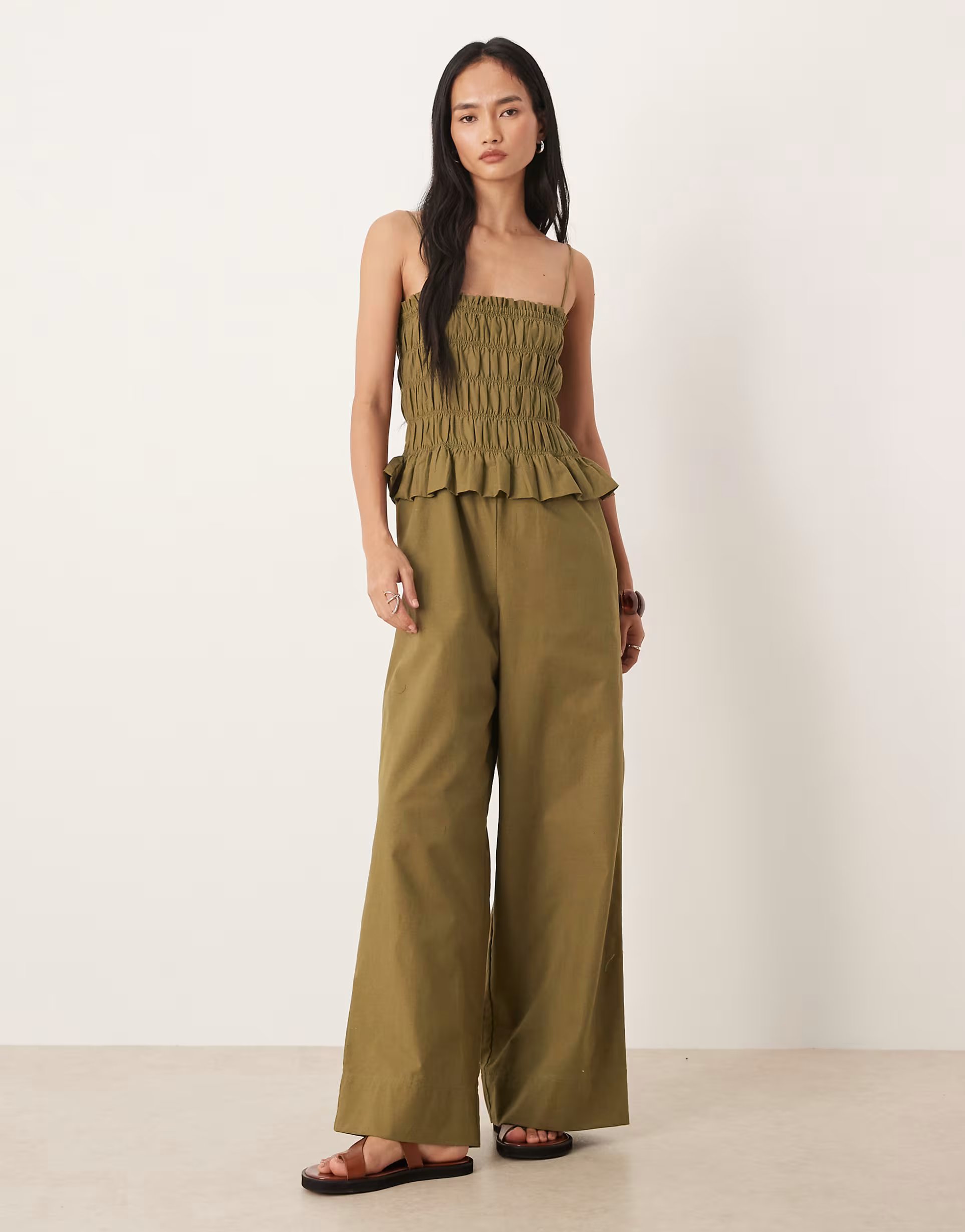 ASOS ASOS DESIGN shirred peplum jumpsuit in khaki - 1