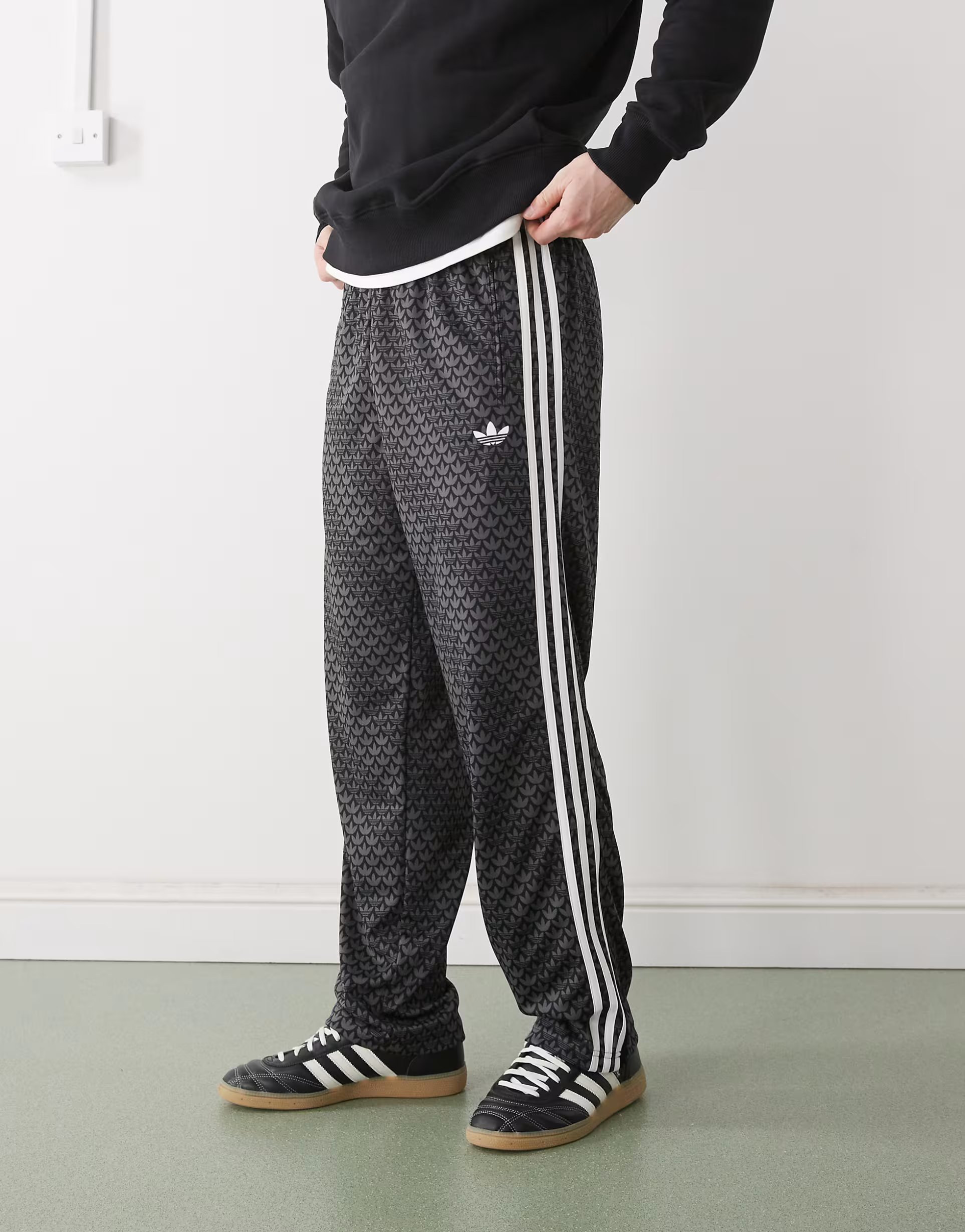 ASOS adidas Originals Firebird loose monogram track pants in black - 1