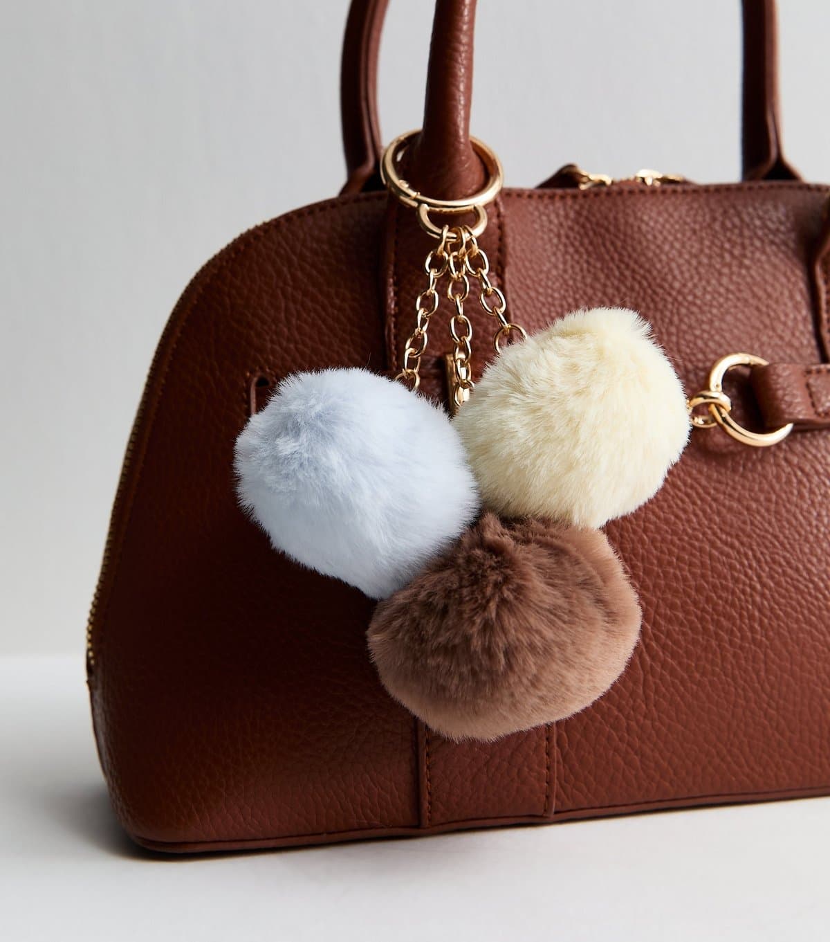 New Look Yellow Blue and Brown Three Pom Pom Bag Charm New Look
