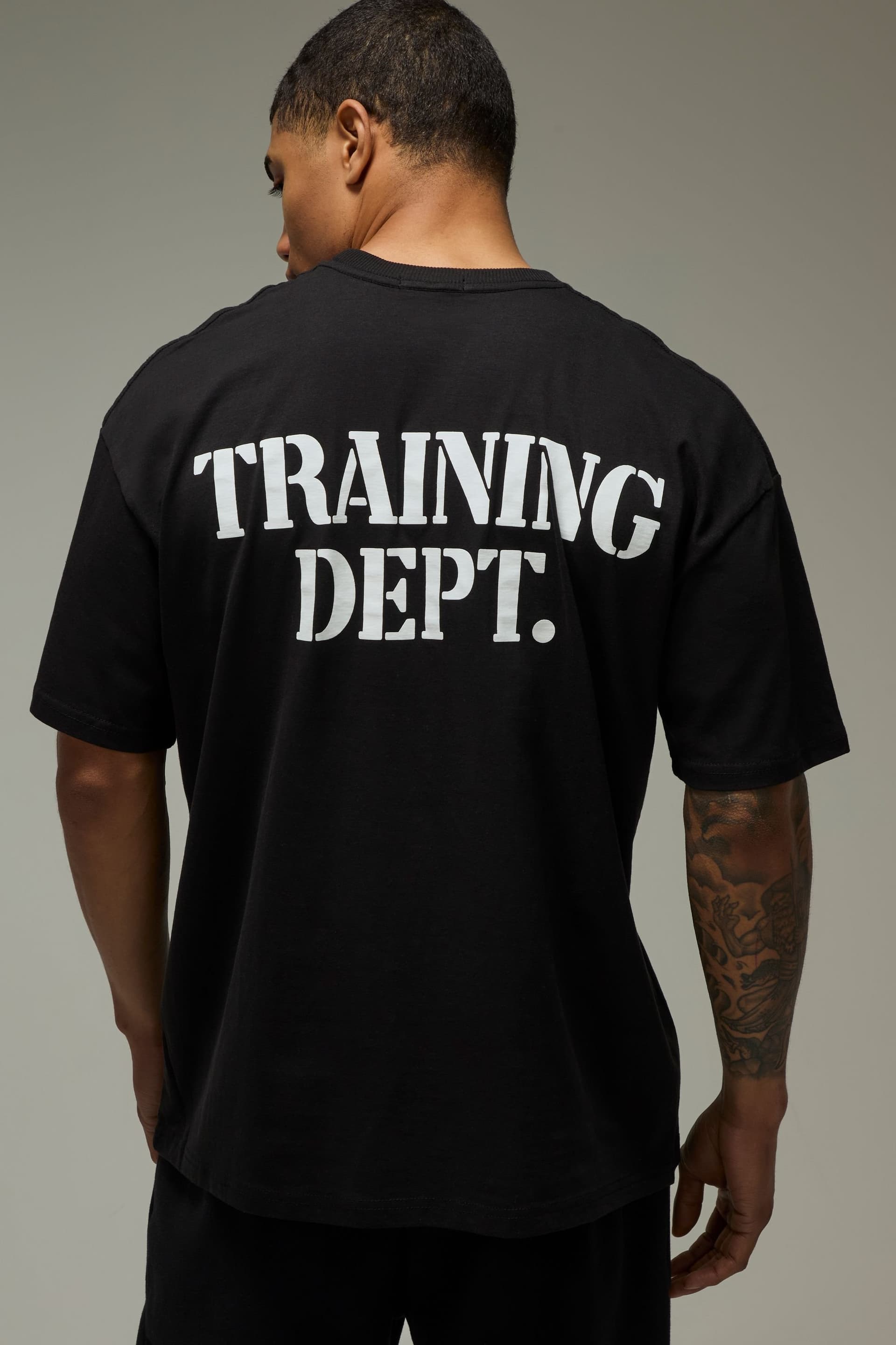Training Dept. Training Dept. Men's Training Dept Stencil Oversized T-Shirt in Black