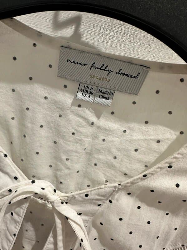 Never Fully Dressed Never Fully Dressed white polka dot blouse