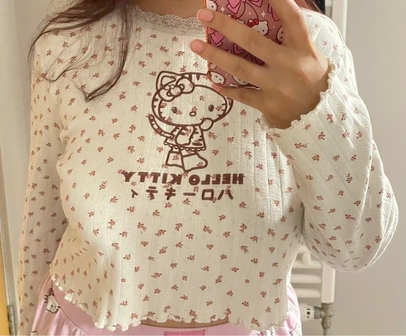 Bershka Bershka white long sleeve Hello Kitty floral crop top in size 12