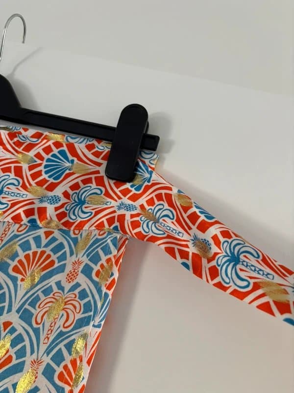 Never Fully Dressed 🌴 Never Fully Dressed wrap skirt in vibrant tropical print with gold foil detailing 🌴