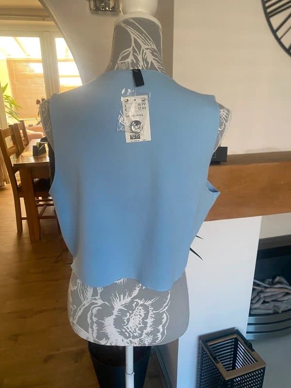H&M Ladies light blue top/waistcoat size 12