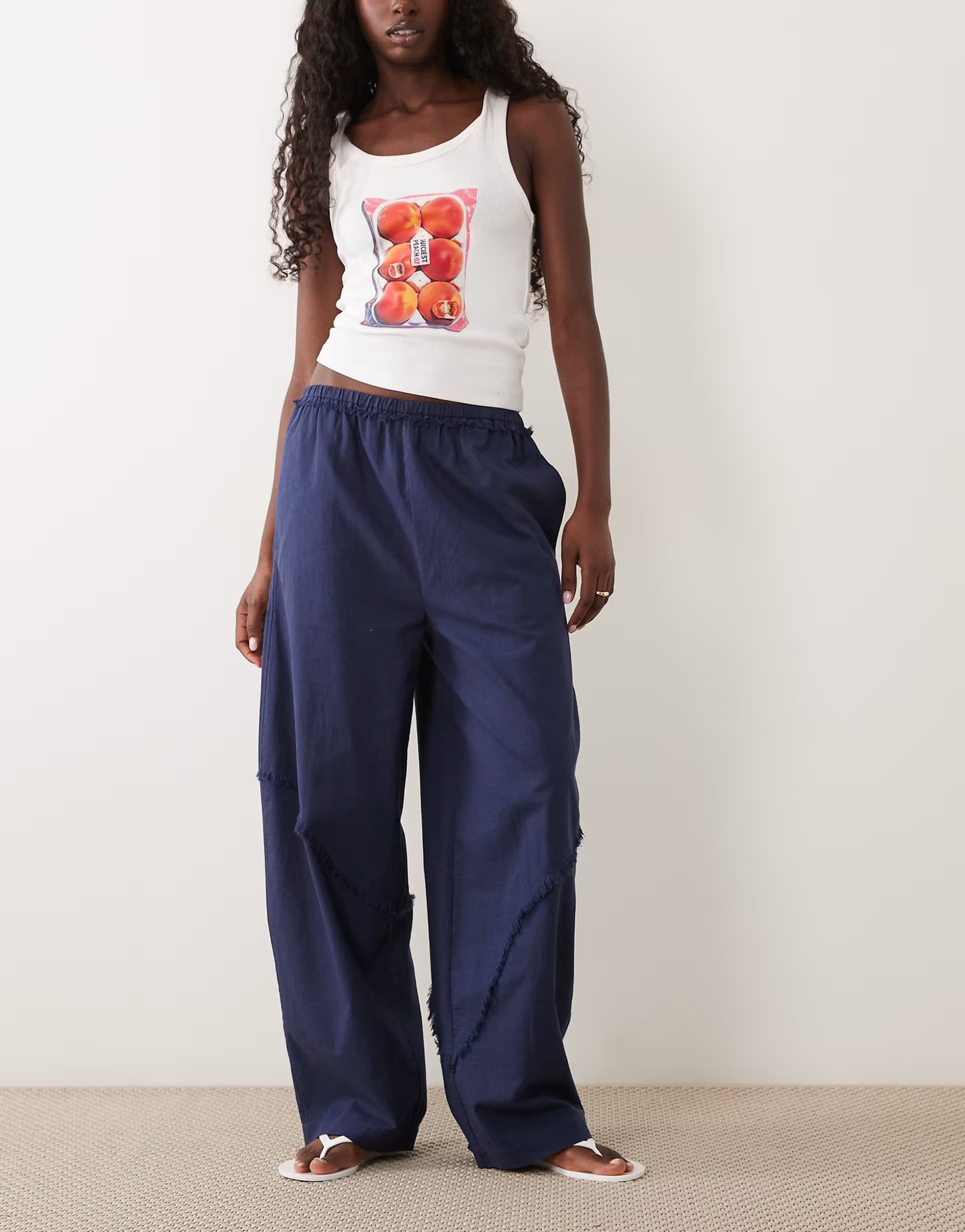 ASOS ASOS DESIGN linen blend pull on barrel leg trousers with raw seam detail in navy