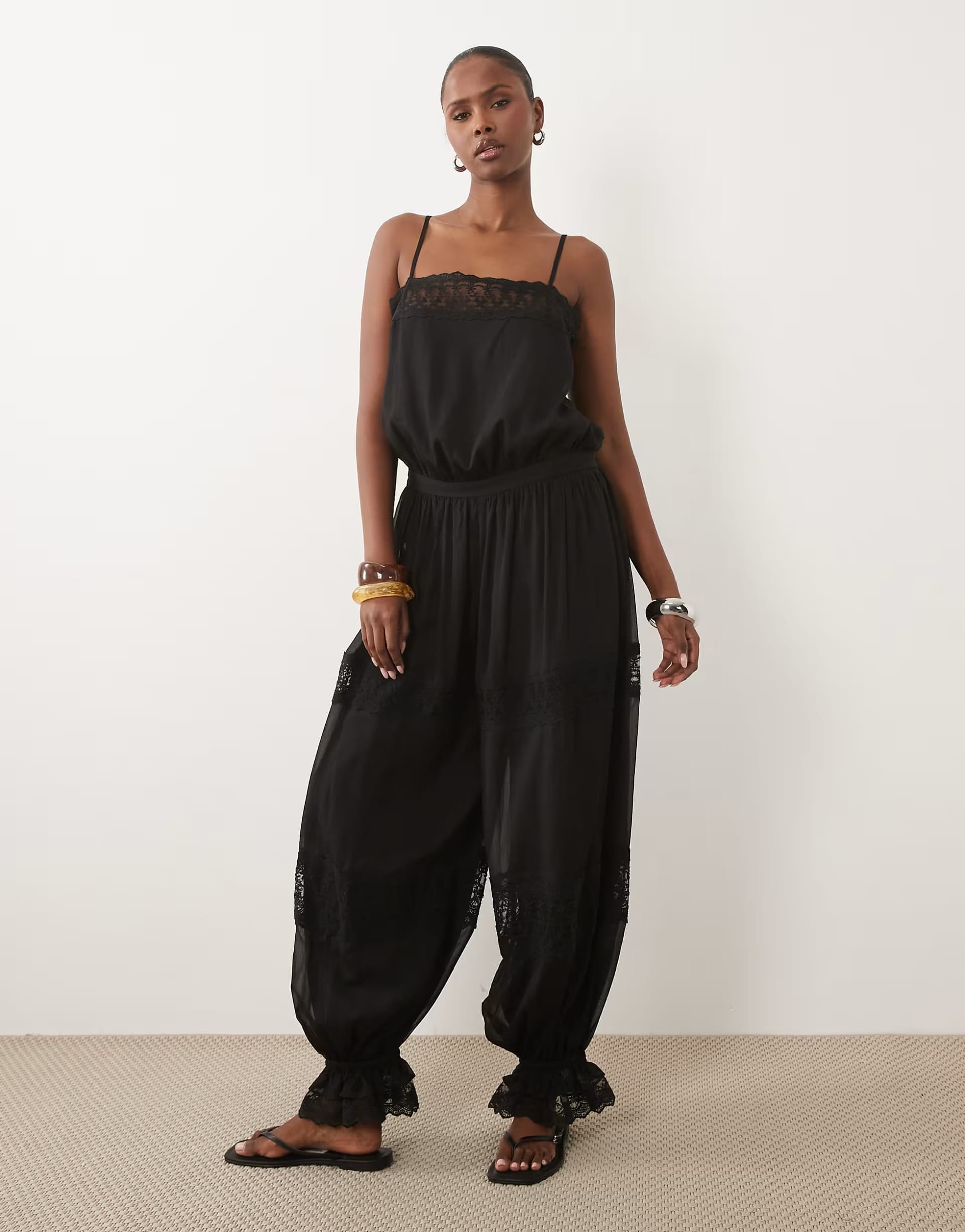 ASOS Sheer Lace Jumpsuit With Bubble Hem In Black