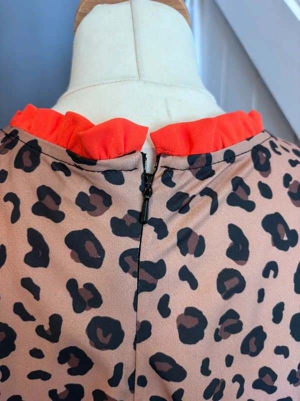 Never Fully Dressed Never  fully dressed leopard print dress with orange trim to neck and black trim to skirt