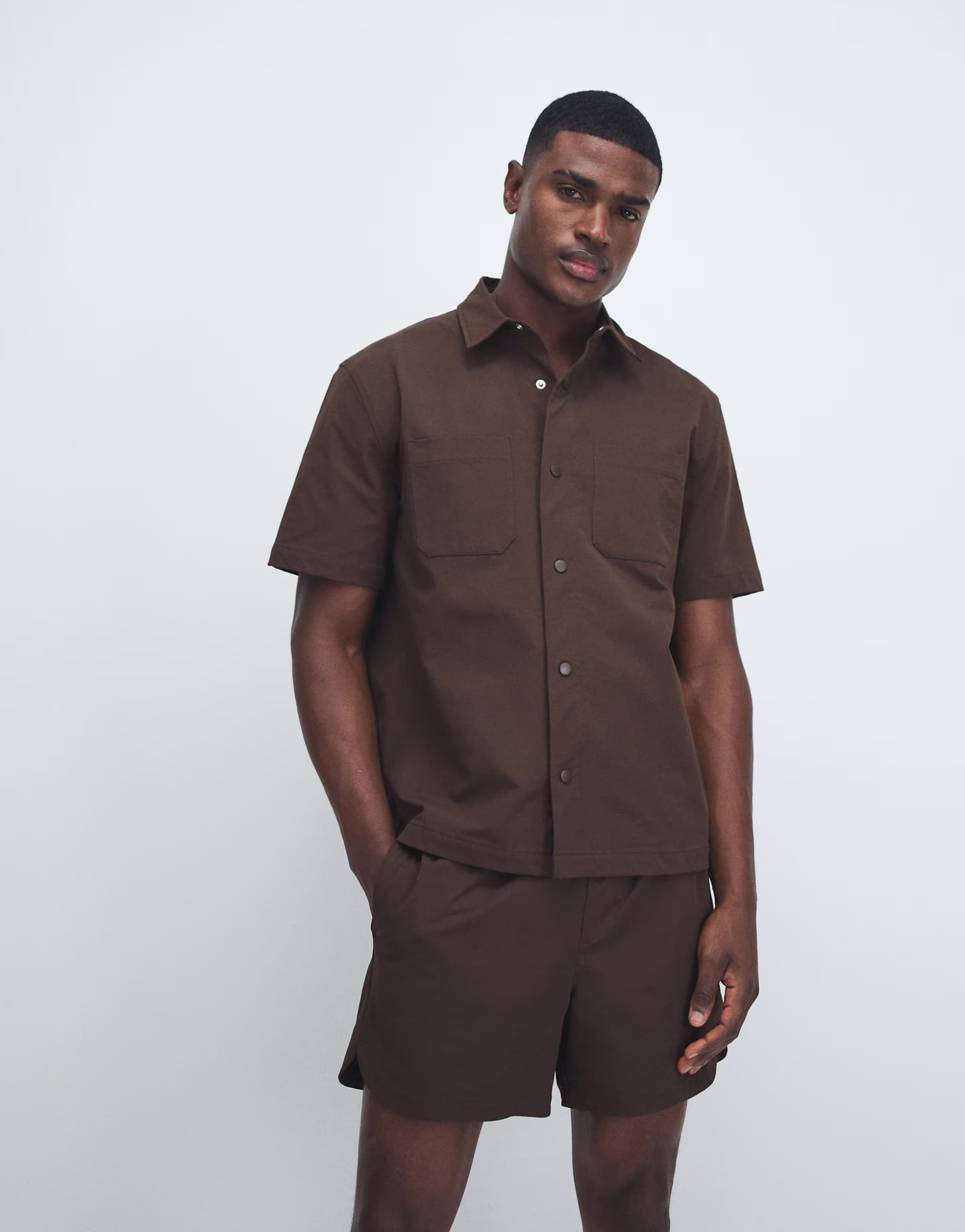 ASOS ASOS DESIGN motionMAX™ relaxed shirt with chest pockets in brown