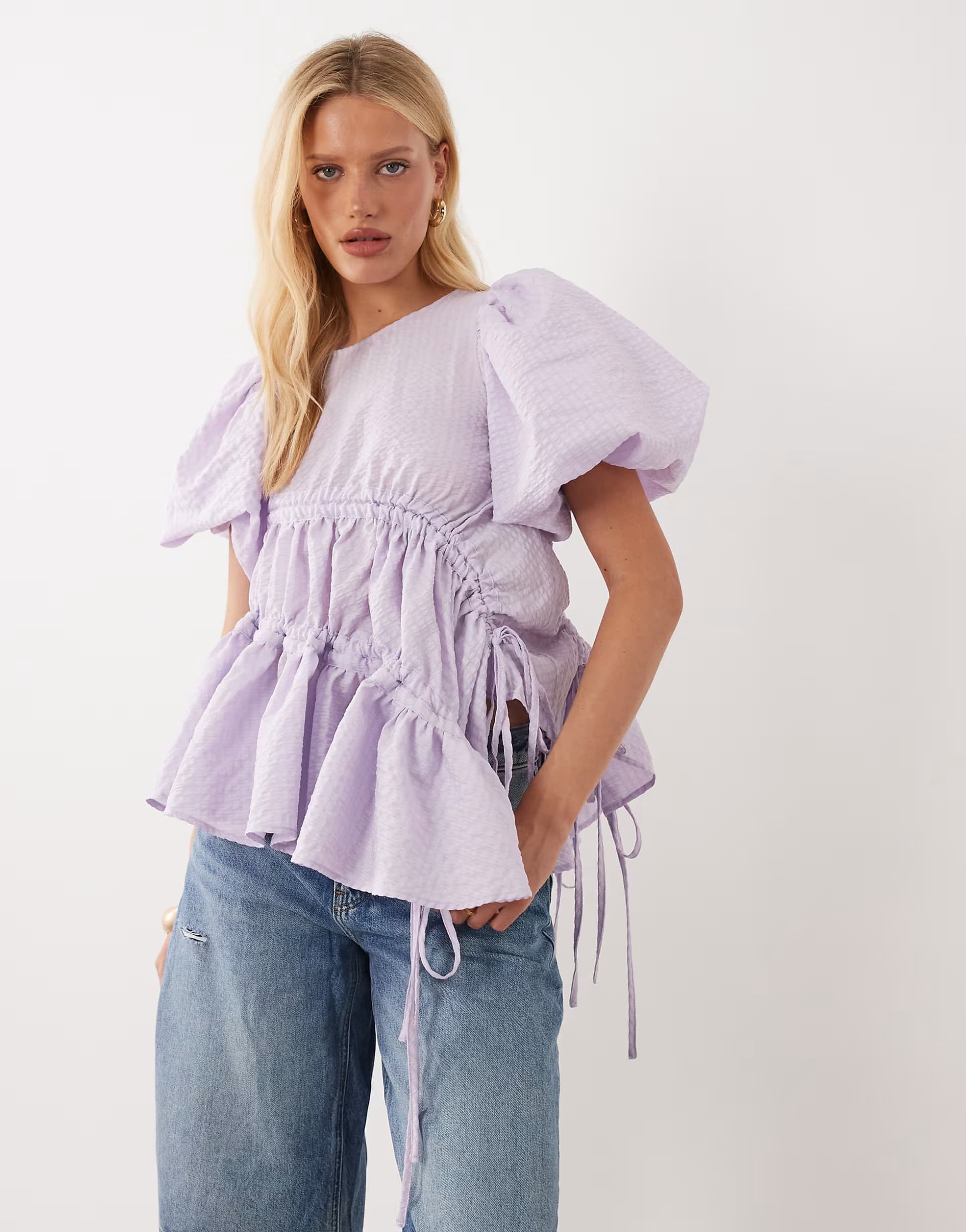 ASOS Ghospell exclusive round neck puff sleeve asymmetric hem floaty top in lilac
