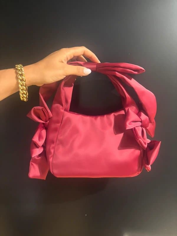 ASOS Adorable ASOS satin clutch bag with bow detail in red