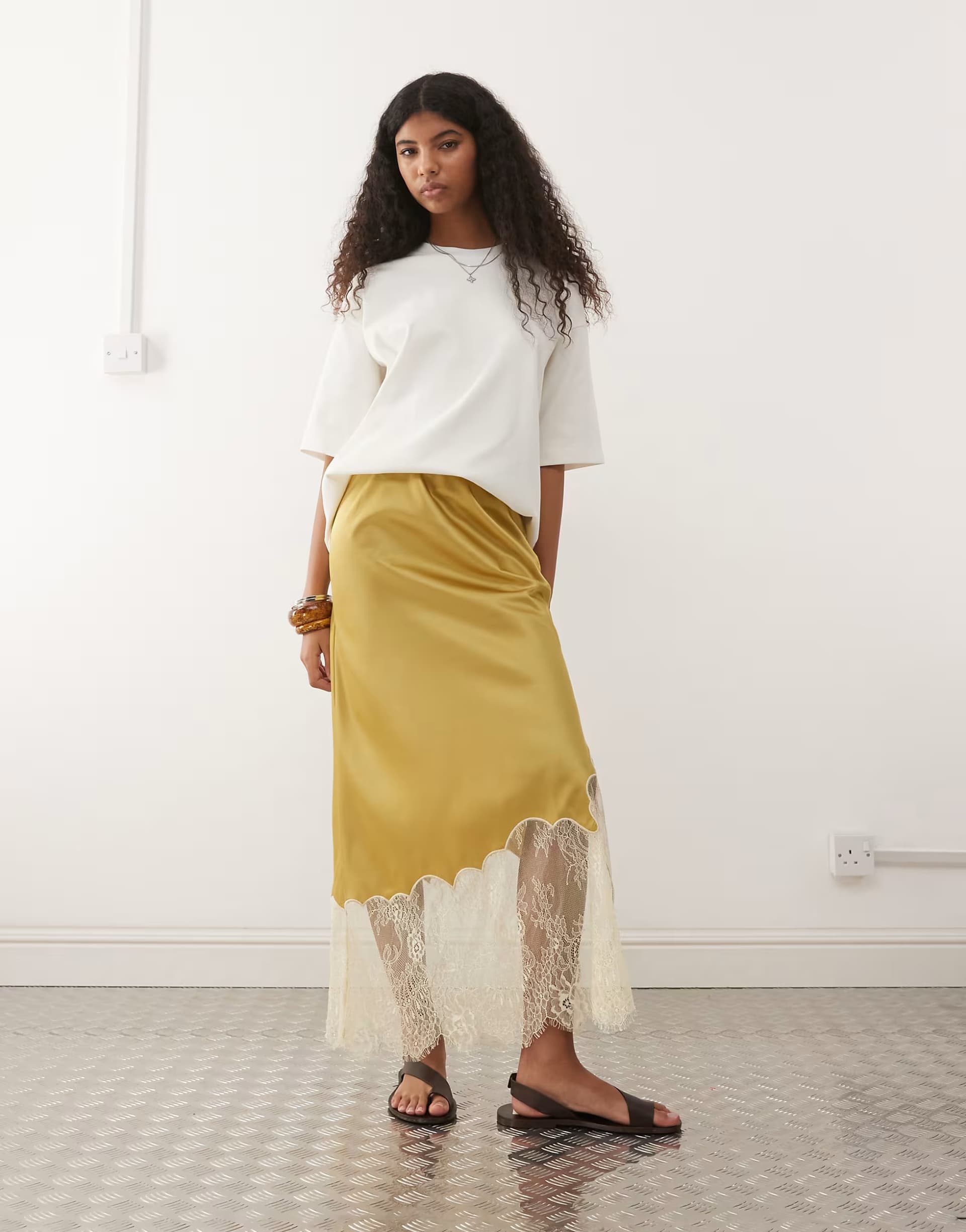ASOS Reclaimed Vintage satin midi skirt with asymmetric hem and lace panel in gold