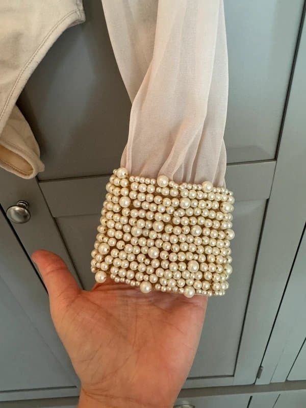 Never Fully Dressed Never Fully Dressed Beige bodysuit with see through sleeves and decorative pearl cuffs