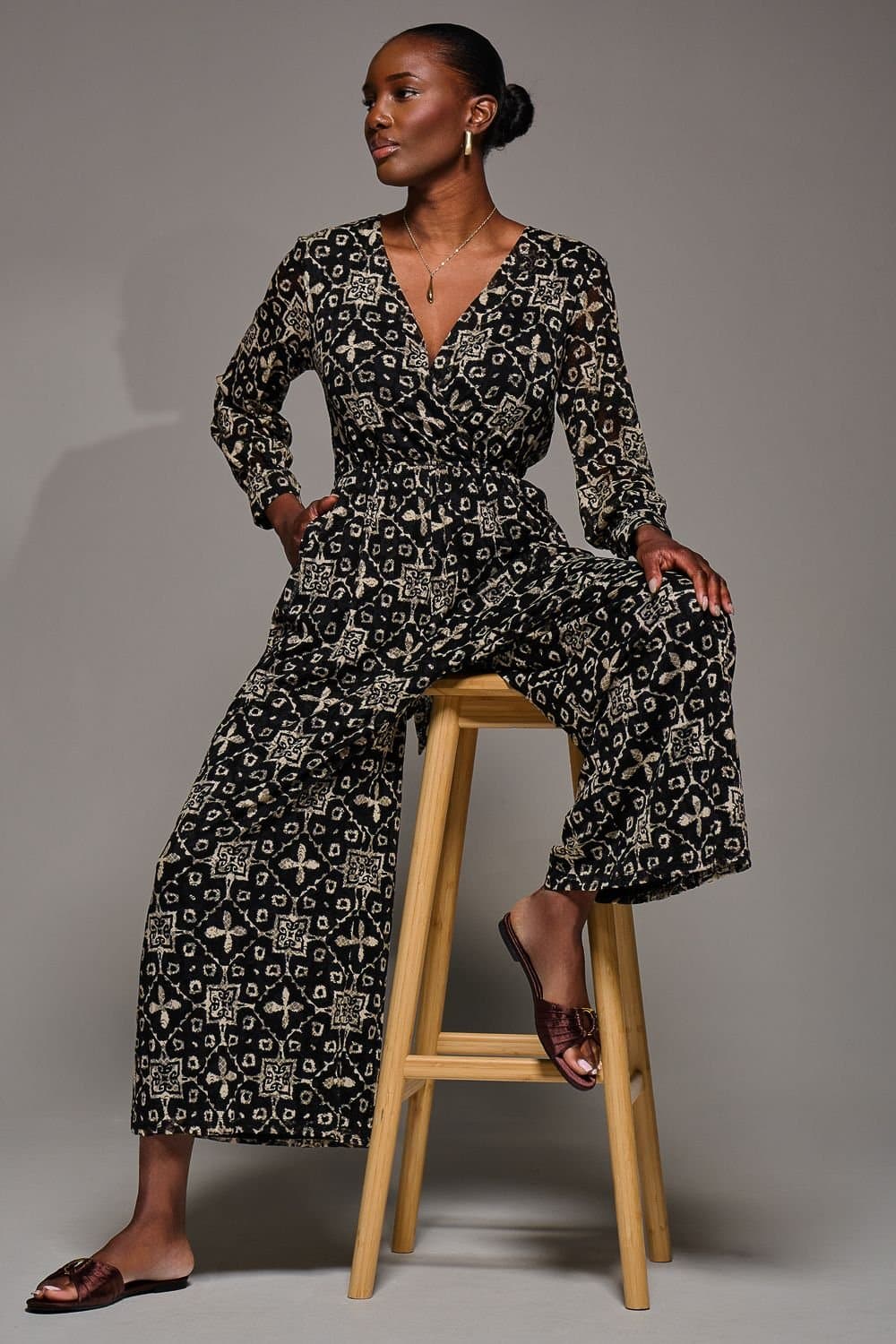 Jolie Moi Jolie Moi Women's Lace Wrap Tie Waist Long Sleeve Jumpsuit in Black