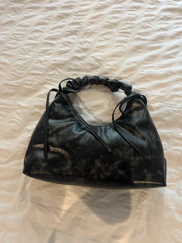 ASOS ASOS design distressed ruched handle shoulder bag with double bow detail in brown