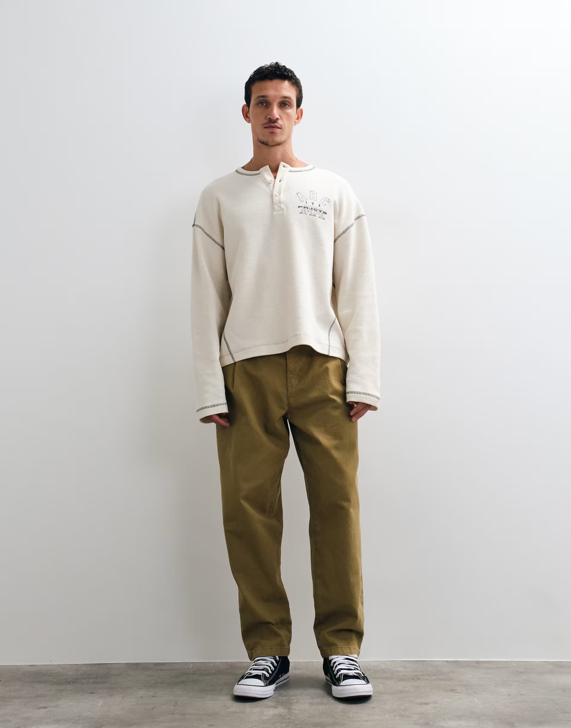 ASOS ASOS DESIGN relaxed tapered trouser with belt and pleats in olive
