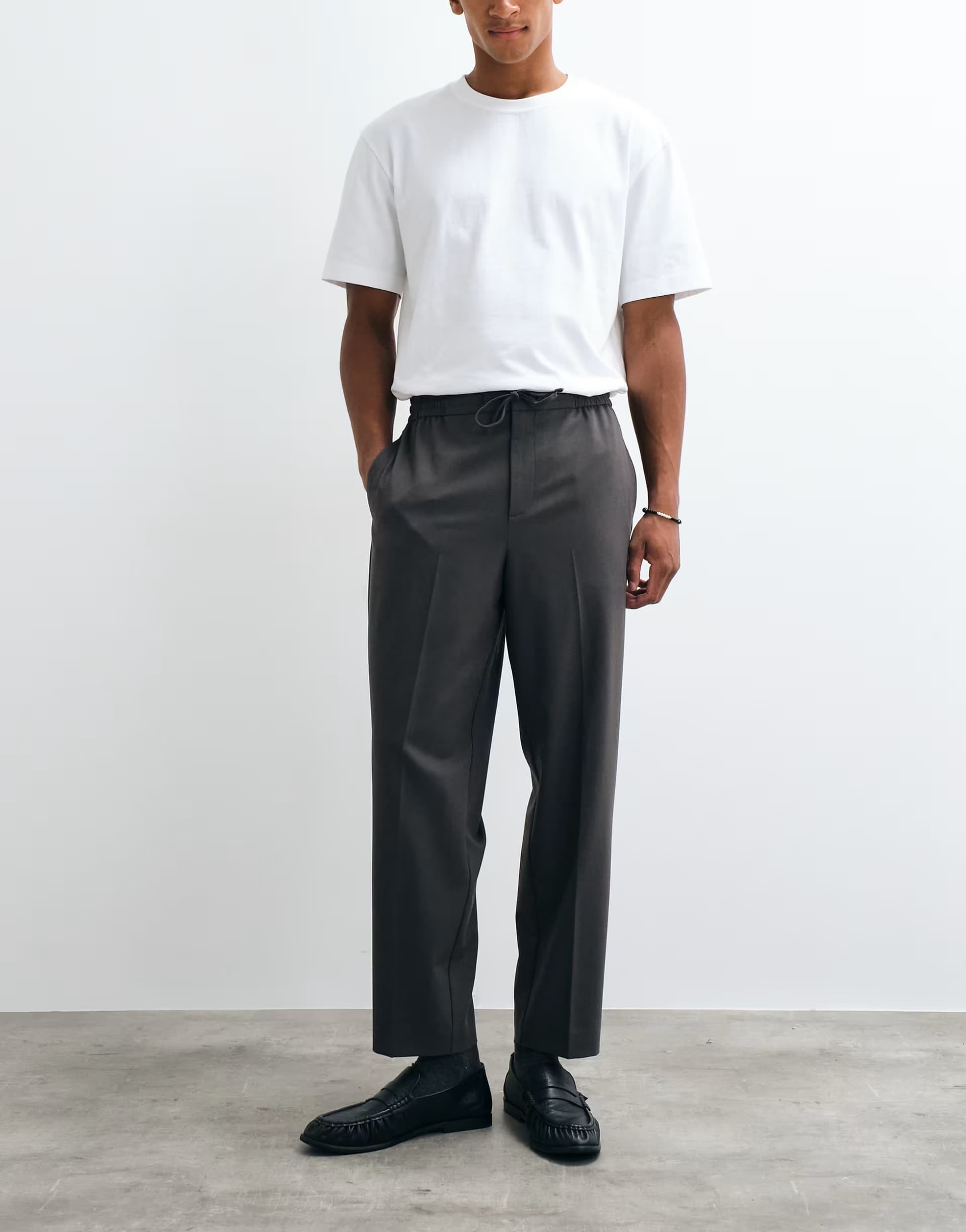 ASOS ASOS DESIGN tailored pull on relaxed tapered trousers in charcoal twill