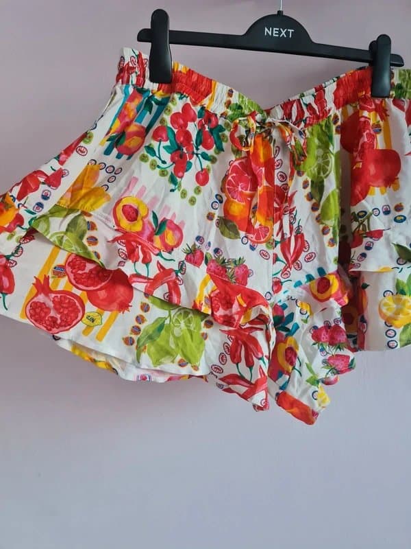 Never Fully Dressed Never fully dressed. Tropical fruit printed skirt shorts.