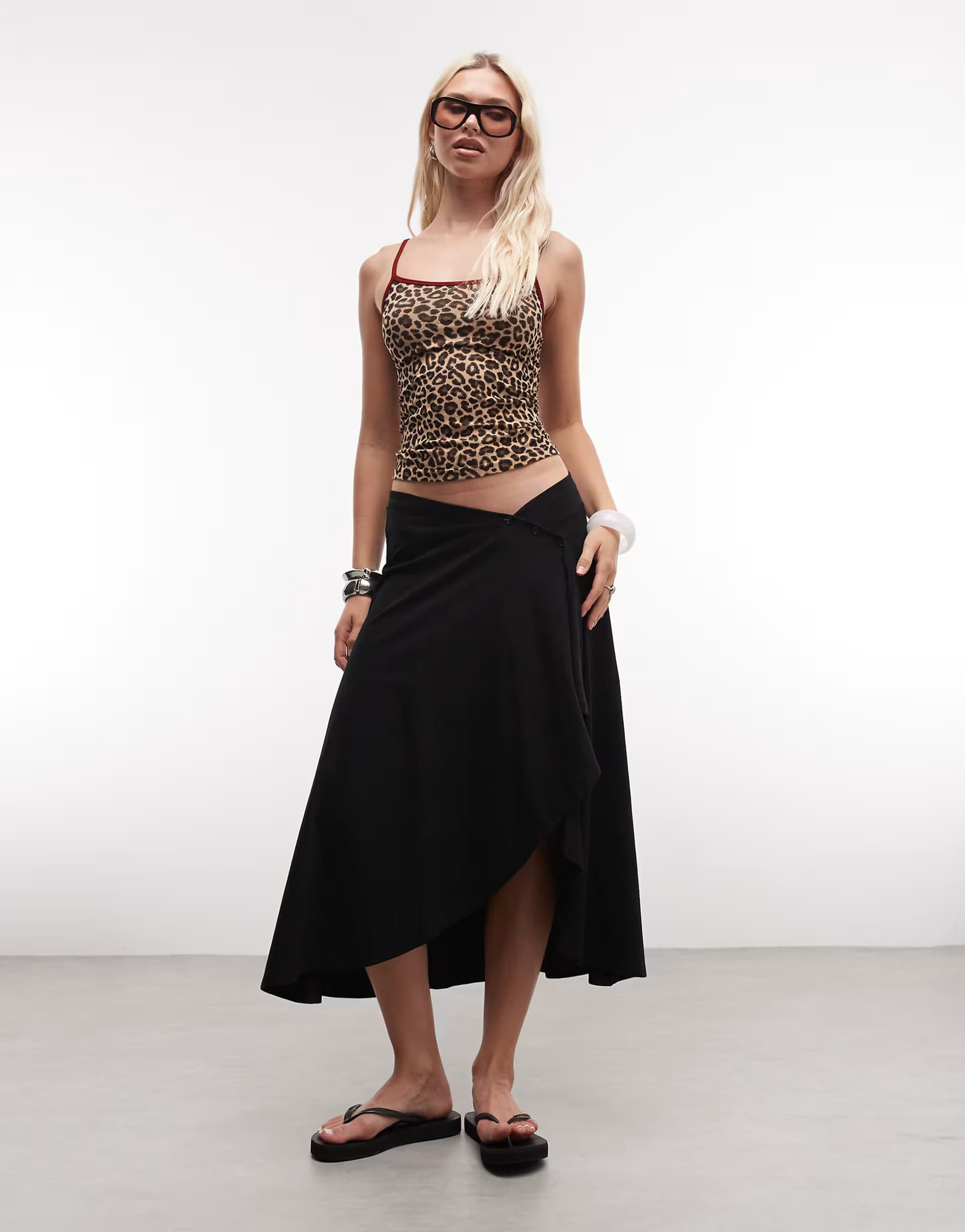 ASOS ASOS DESIGN jersey hanky hem skirt with button detail in black