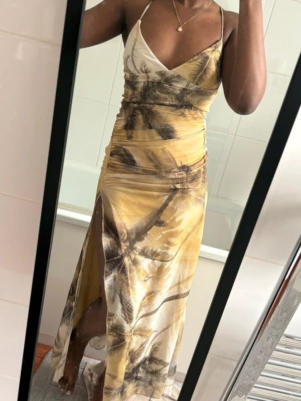 Bershka Bershka tulle halterneck midi dress with a palm tree print and a side slit.