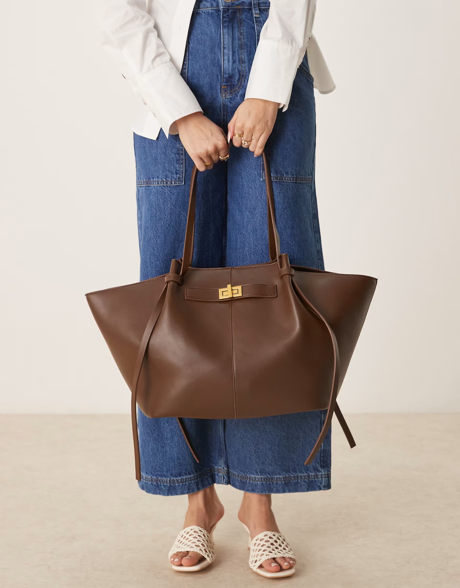 ASOS Gina Tricot faux leather medium tote bag with strap and clutch detail in dark brown