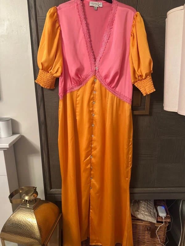 Never Fully Dressed Never fully dressed orange spliced Linda’s dress size 16