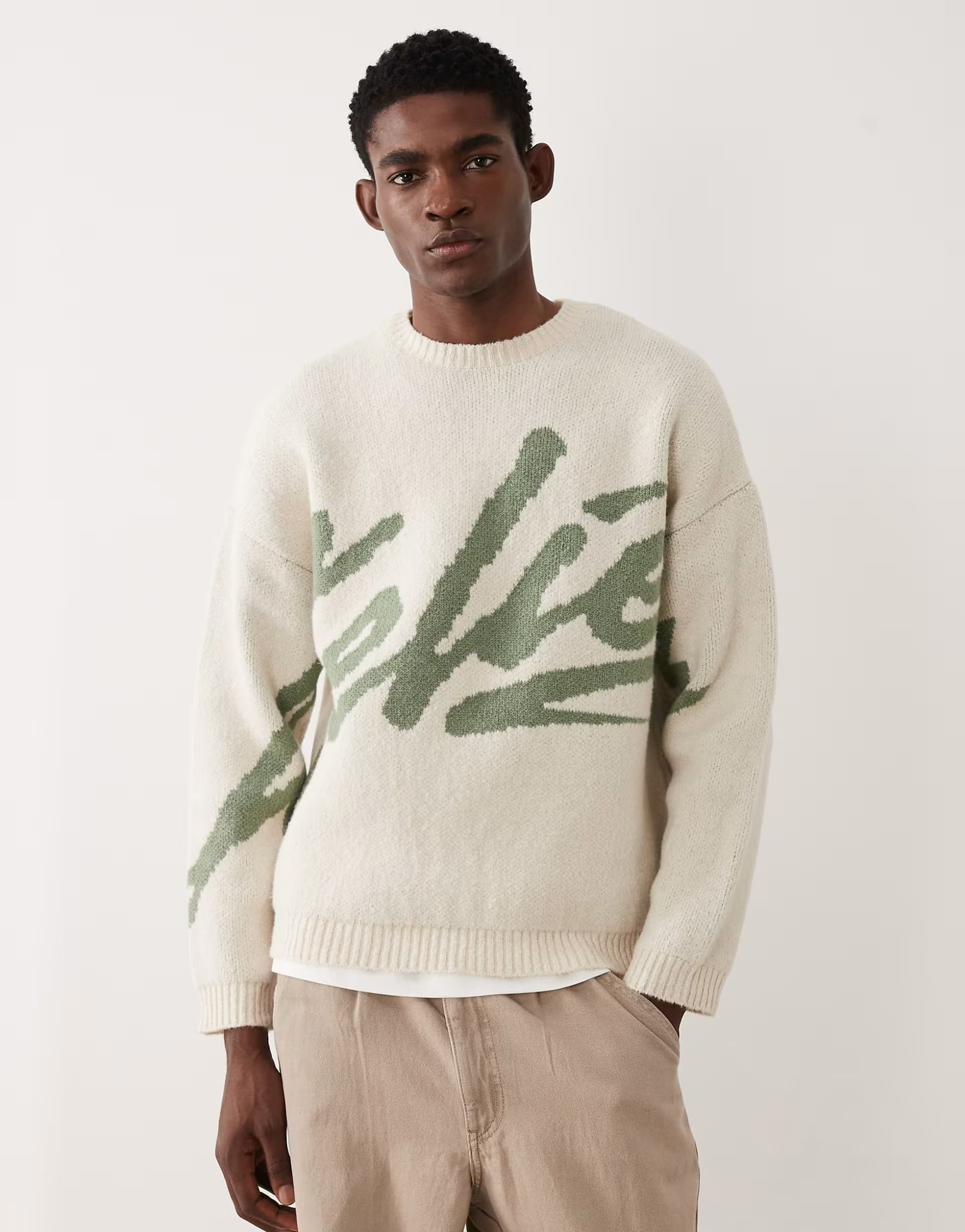 ASOS ASOS DESIGN oversized knitted jumper with 'atelier' graphic in ecru and sage