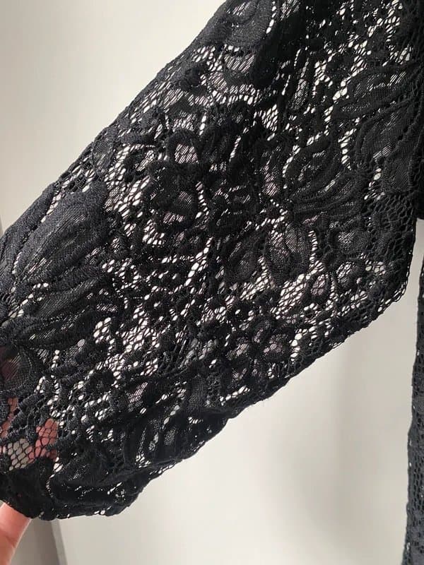 New Look New Look black lace duster cardigan features a sheer, floral design and 3/4 length sleeves.