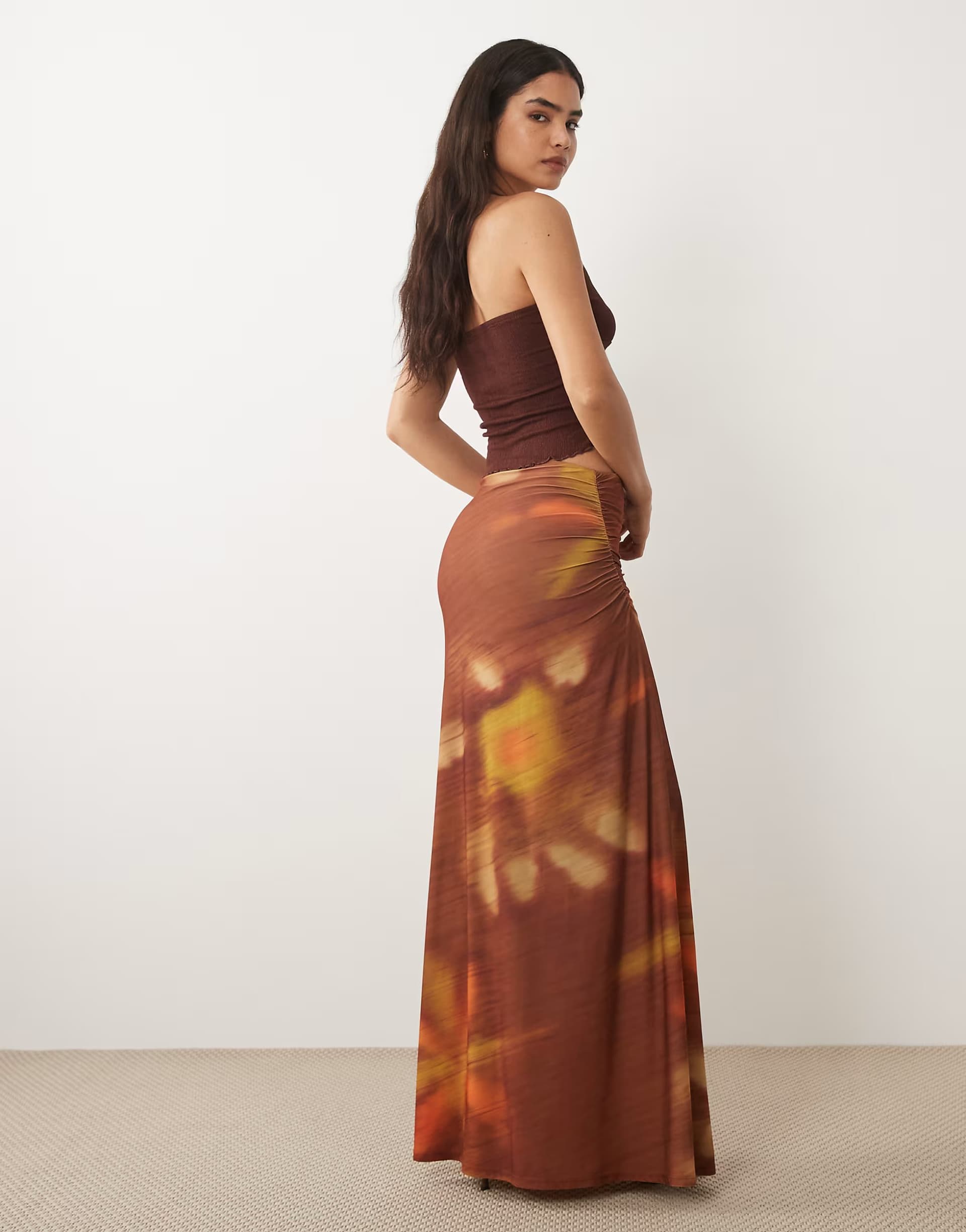 ASOS ASOS DESIGN maxi skirt with ruched side detail in blurred sunset print