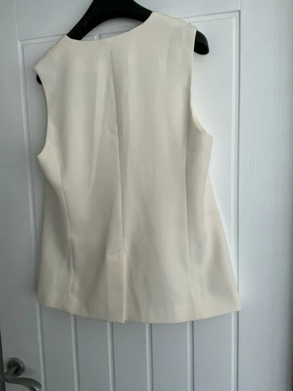 ASOS Design ASOS Design women’s long cream waistcoat, with buckle fastenings.