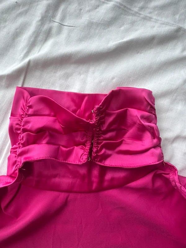 Never Fully Dressed Never Fully Dressed pink backless blouse with a tie-up back detail.