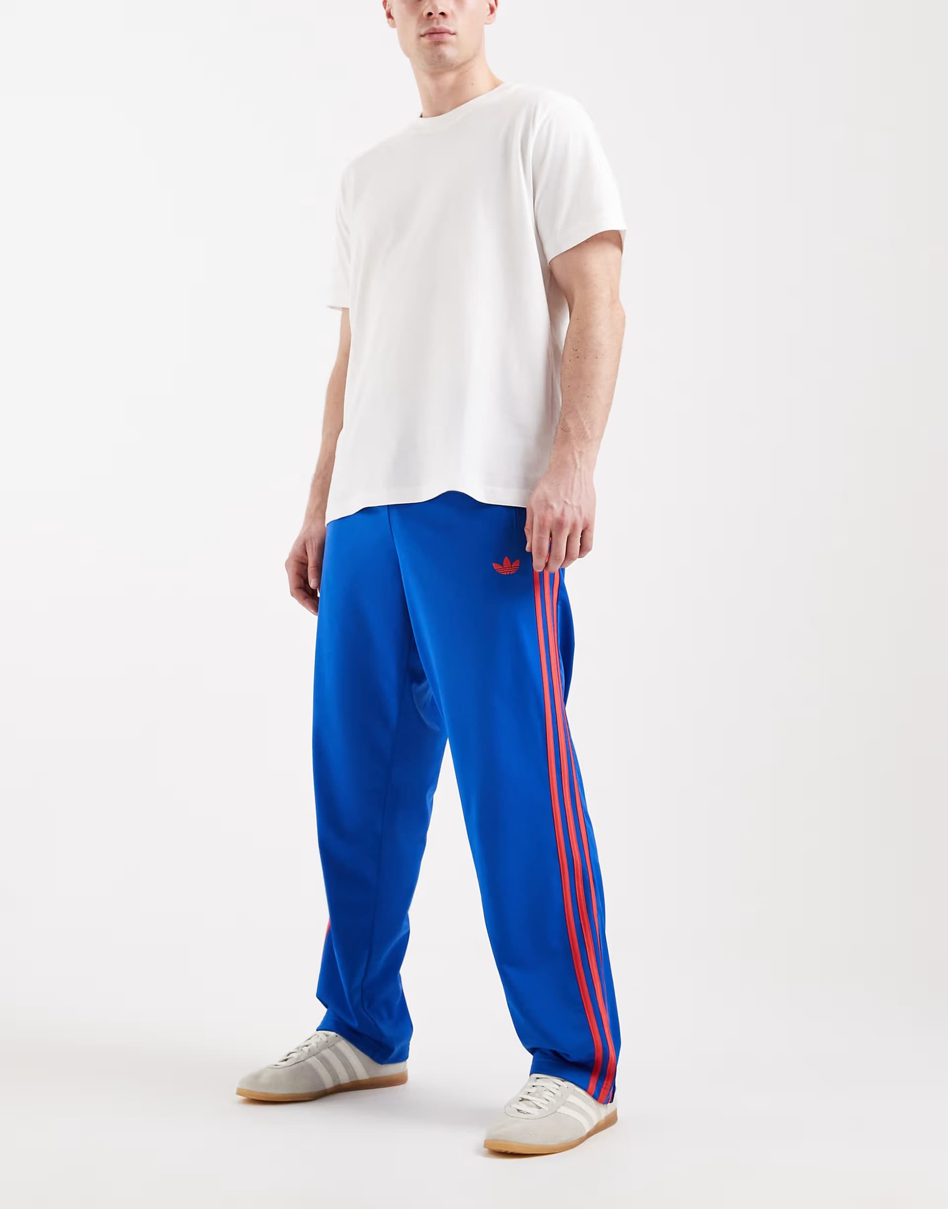 ASOS adidas Originals Firebird track pants in blue