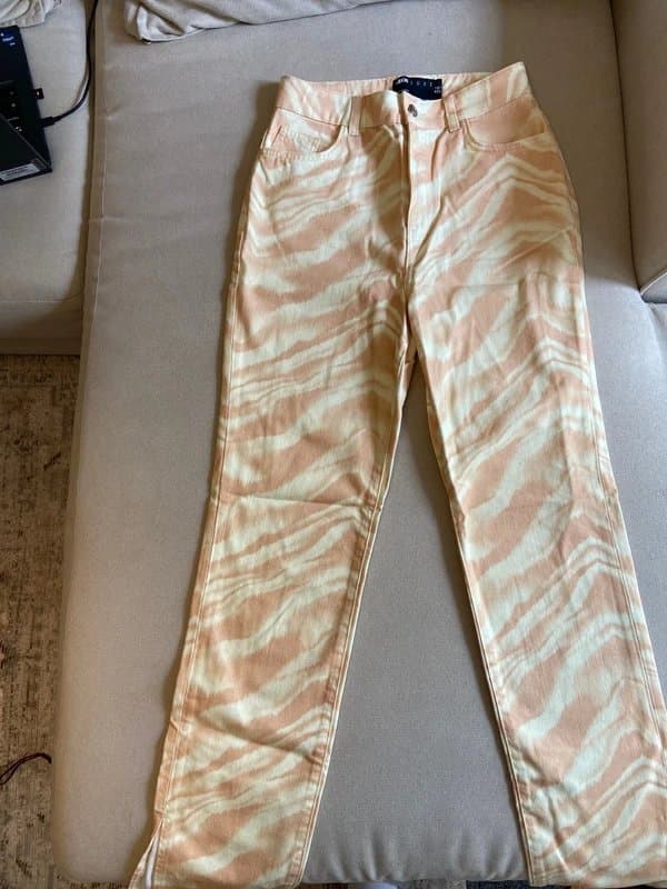 ASOS Zebra print washed jeans in peach and cream with split hem