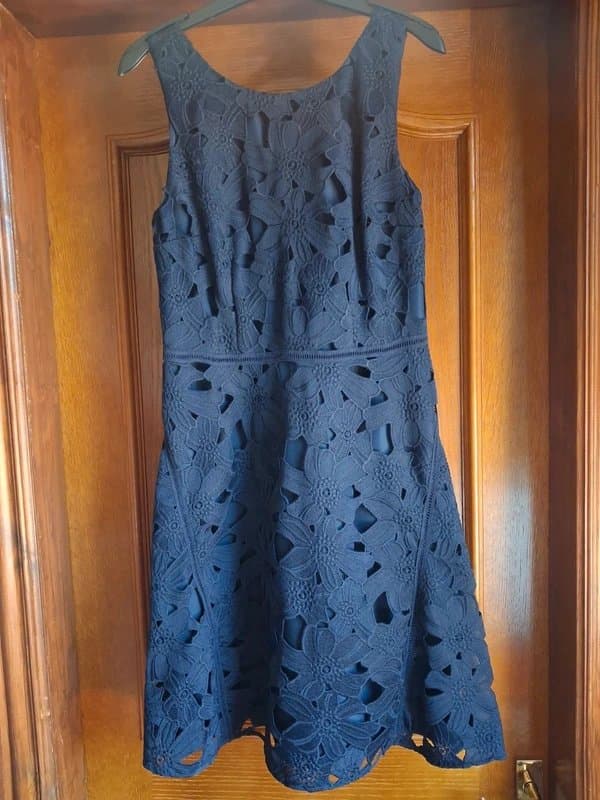 Next New, with tags, NEXT sleeveless, smart navy cut out skater style dress, size 10.