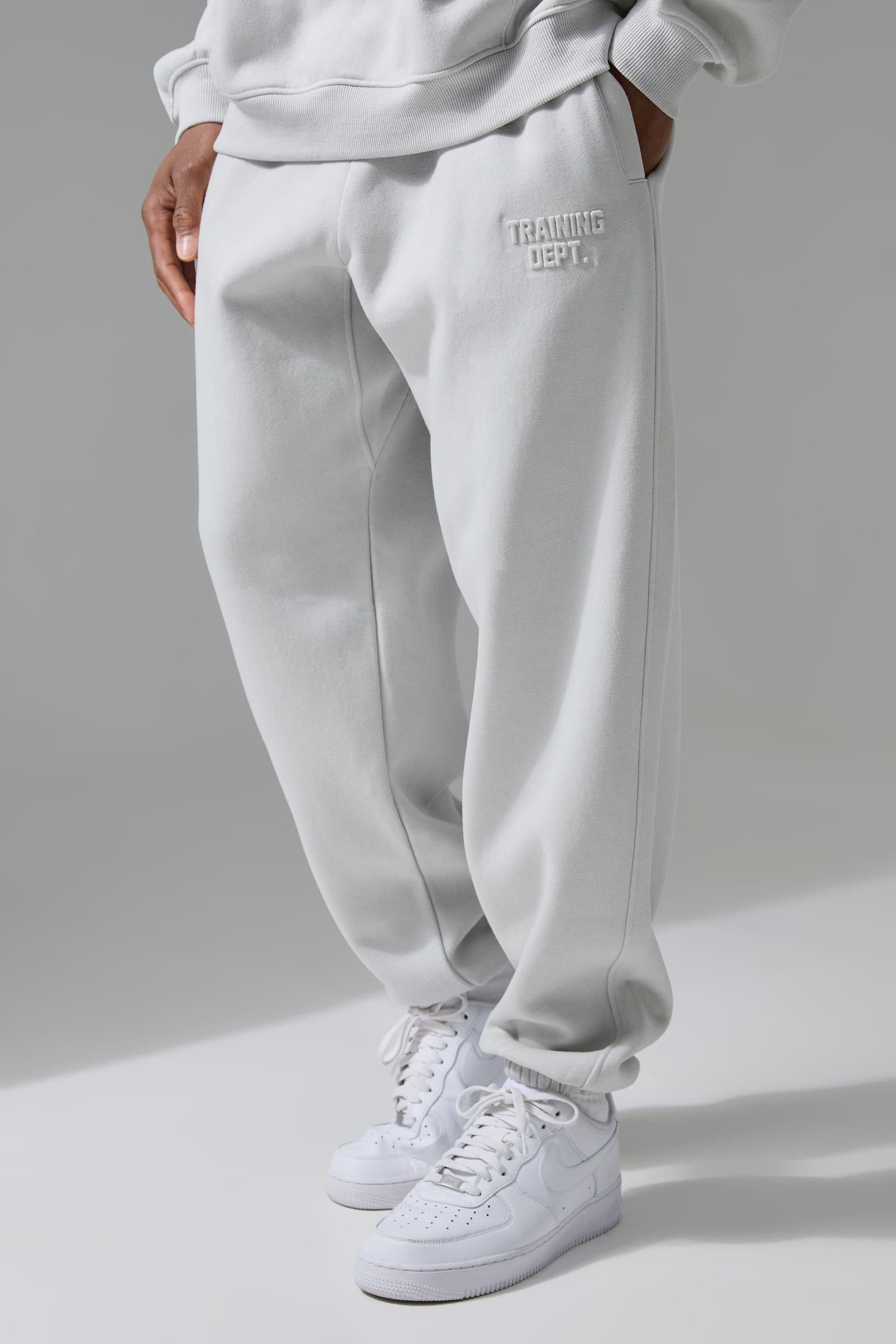 Training Dept. Training Dept. Men's Training Dept Oversized Embossed Jogger in Light Grey