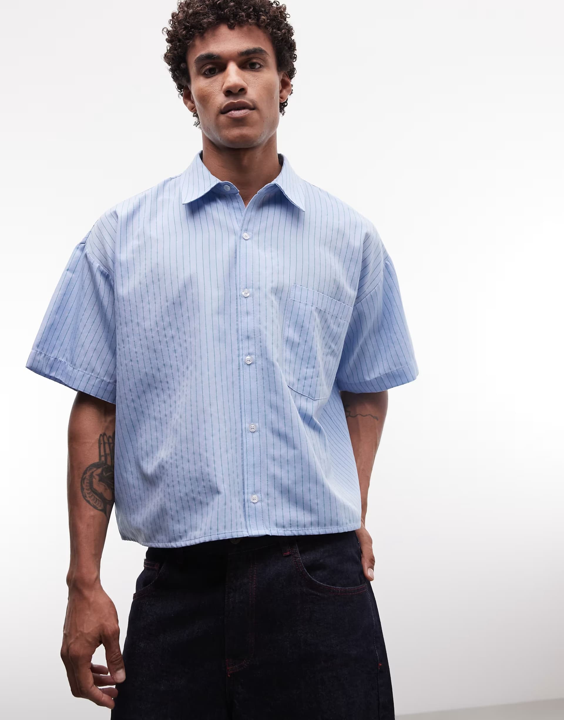 ASOS Reclaimed Vintage short sleeve boxy shirt in washed blue stripe