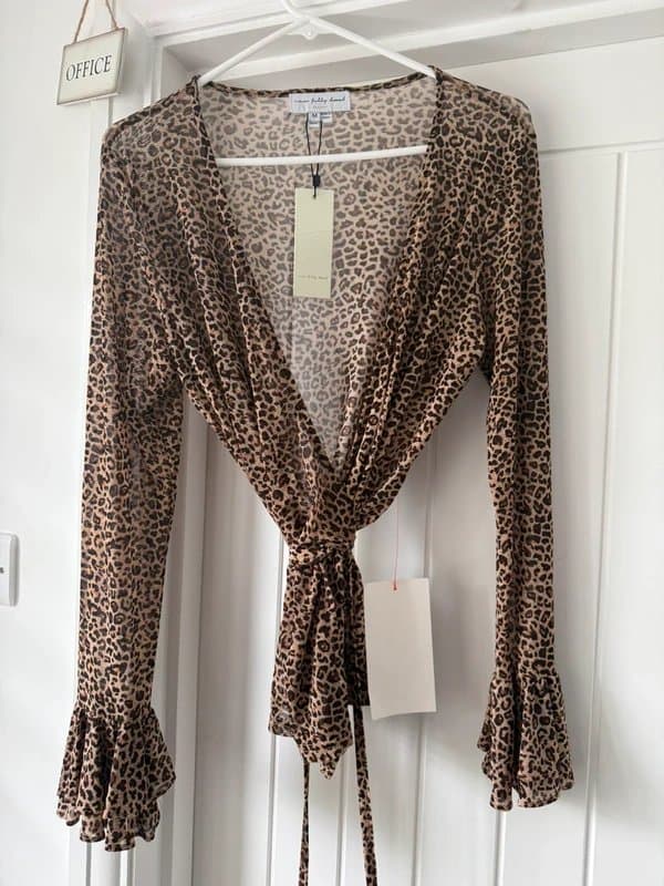 Never Fully Dressed Never fully dressed wrap over, leopard sheer top