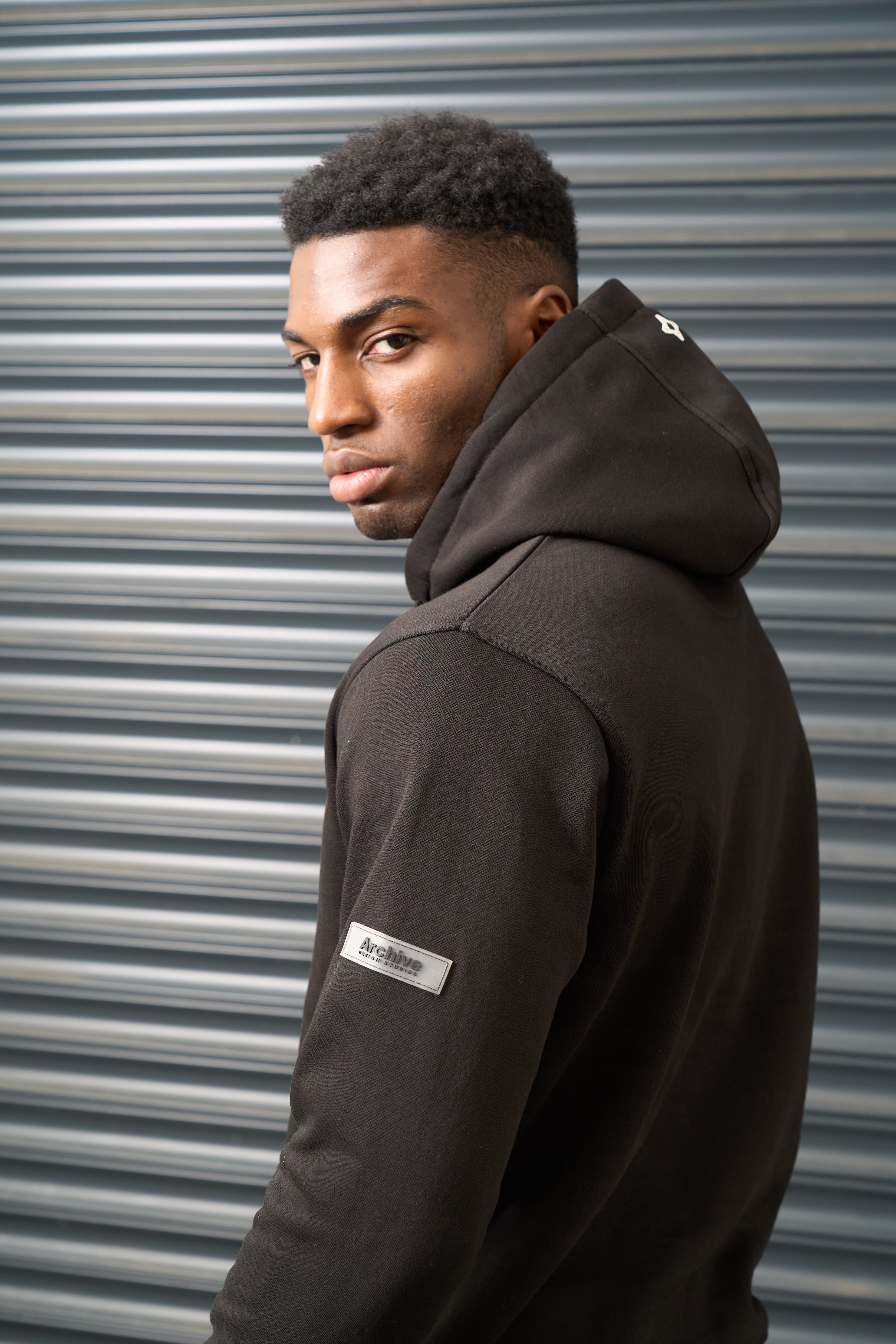Archive Design Studios Archive Design Studios Archive Men's Joro Hoodie - Brushed Back Fleece with Rubber Sleeve Badge in Black - 3