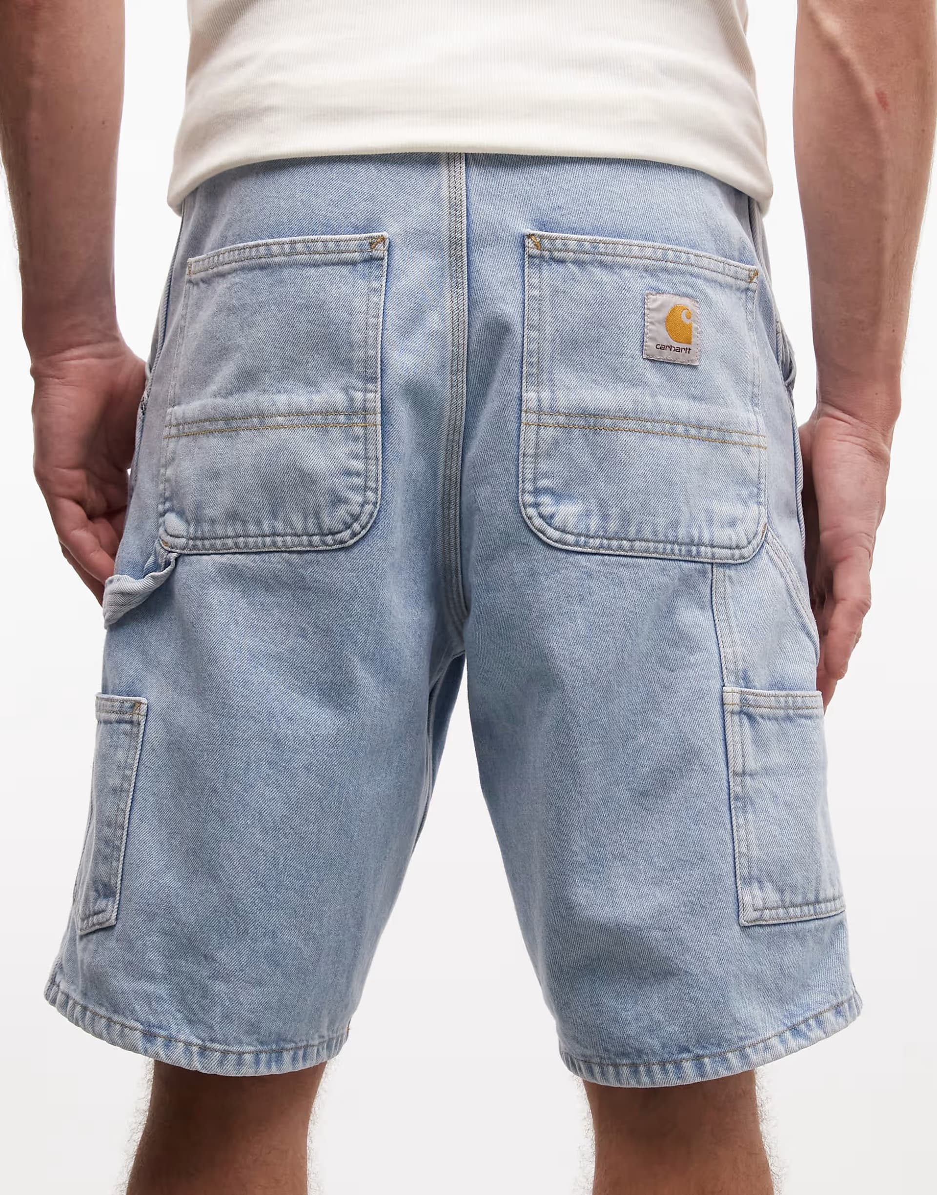 ASOS Carhartt WIP single knee shorts in light wash blue
