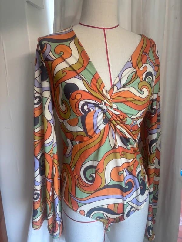 Never Fully Dressed Never Fully Dressed retro Groove plunge body suit.