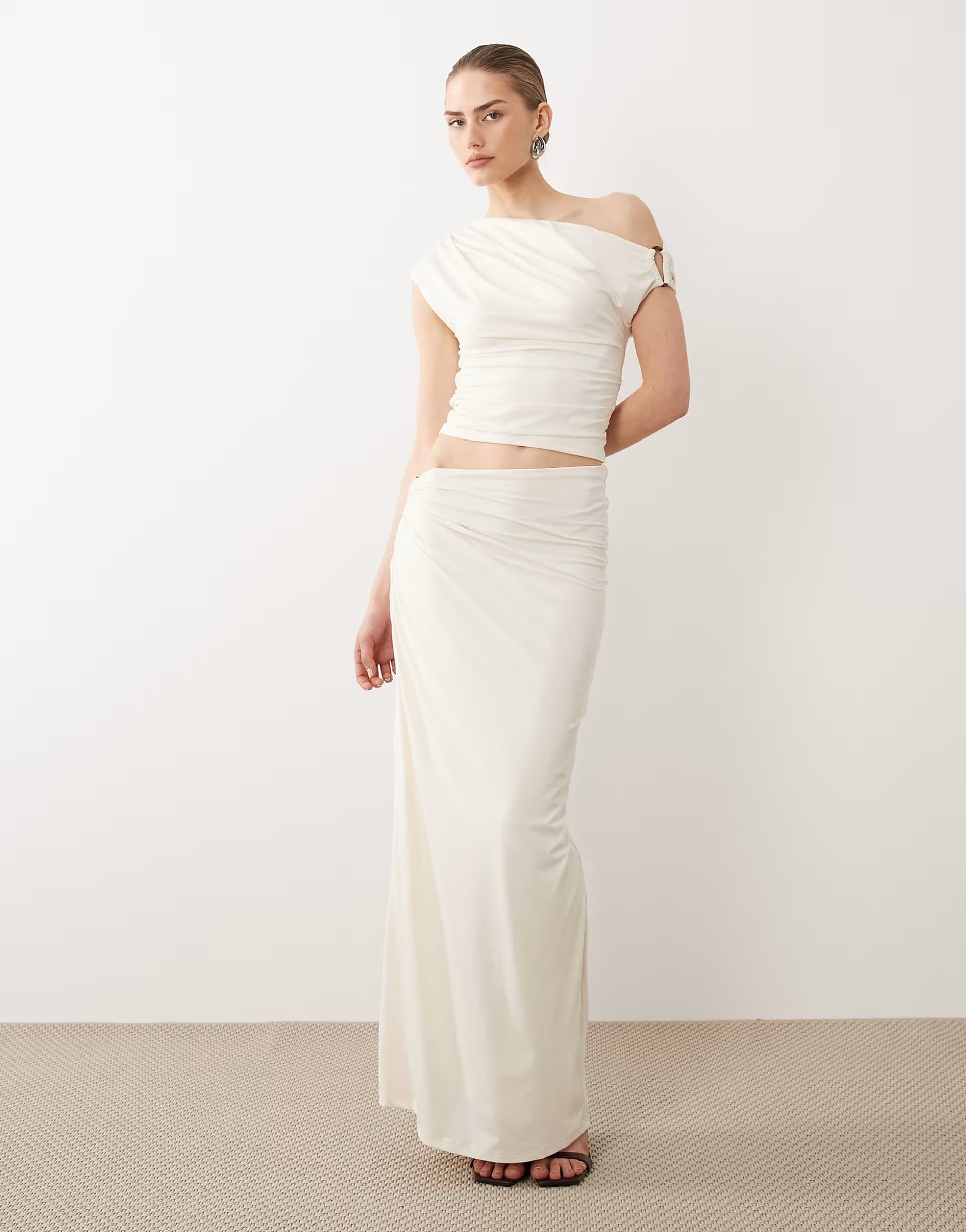 ASOS SNDYS off shoulder drape top co-ord and beaded ring detail asymmetric waist maxi skirt co-ord in cream