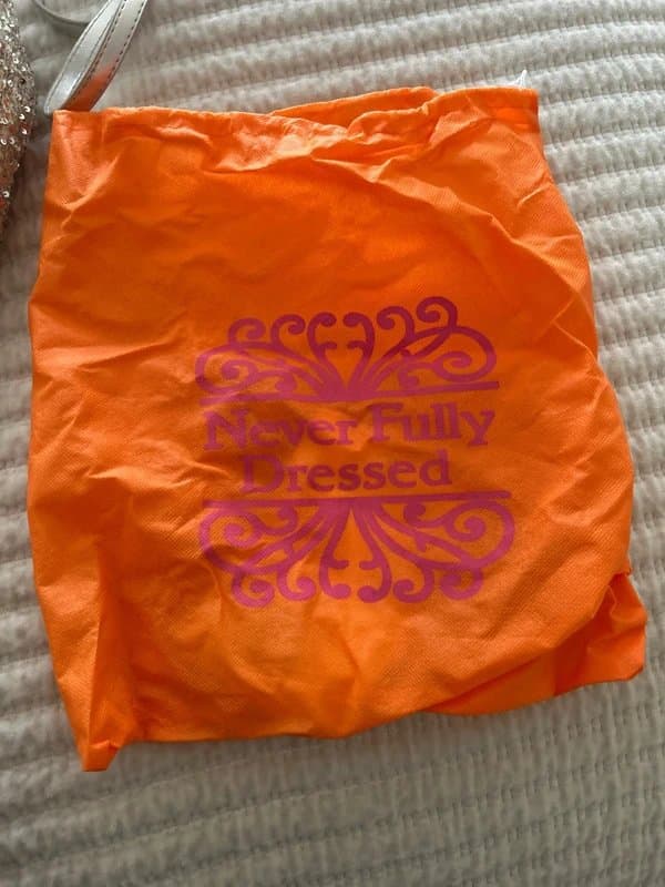 Never Fully Dressed Never fully dressed sequin couch bag